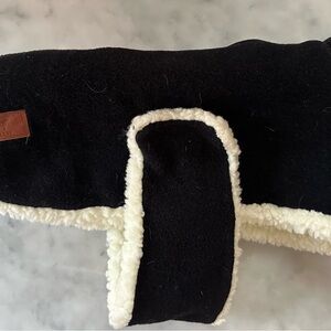 Black coat/medium size dog. Easy velcro closures at neck and tummy.